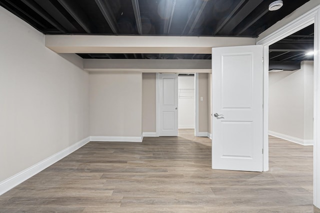 basement featuring hardwood / wood-style flooring