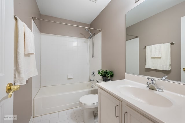 full bathroom featuring tile patterned flooring, vanity, tiled shower / bath combo, and toilet