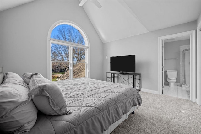 carpeted bedroom featuring ensuite bathroom, ceiling fan, and lofted ceiling