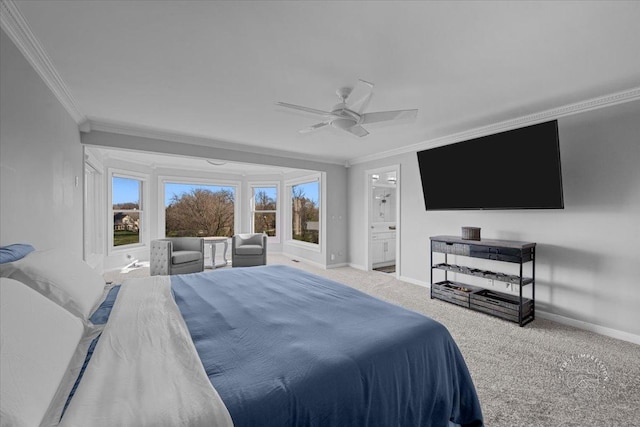 bedroom featuring carpet flooring, ensuite bathroom, ceiling fan, and ornamental molding