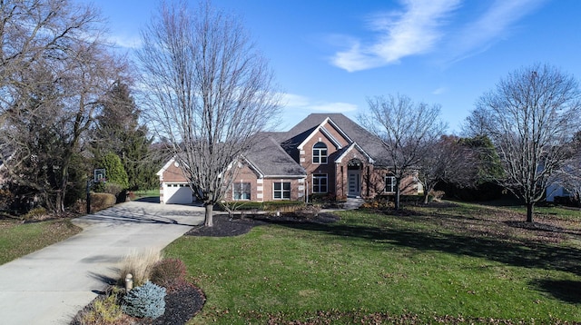 view of front facade with a garage and a front lawn