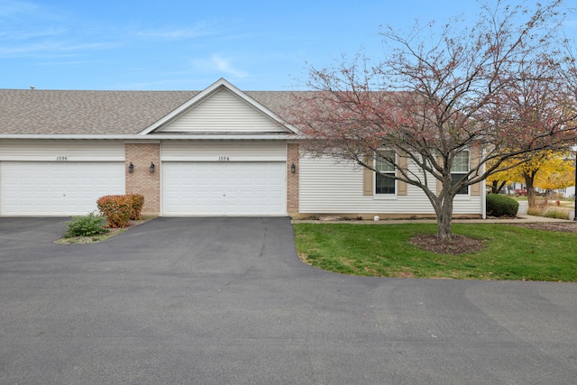 single story home featuring a garage