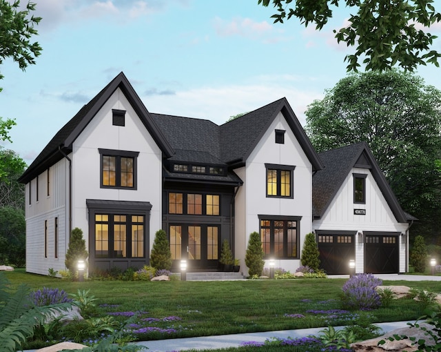 view of front of home featuring french doors, a front lawn, and a garage