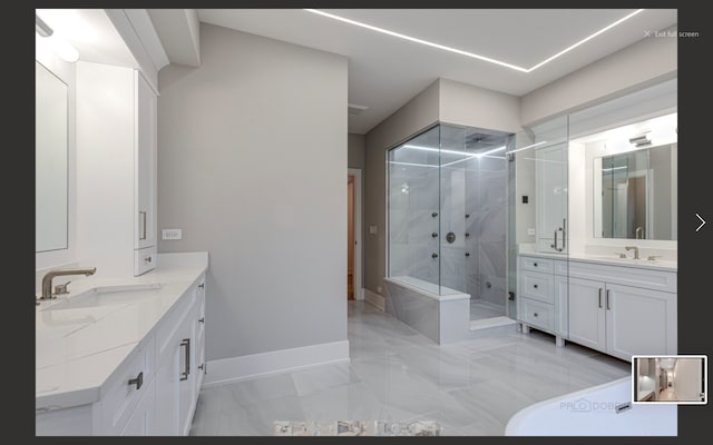 bathroom featuring vanity and walk in shower