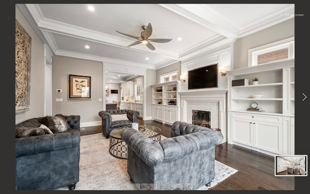 living room featuring beam ceiling, ceiling fan, dark hardwood / wood-style flooring, and ornamental molding