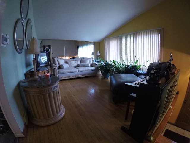 living room featuring hardwood / wood-style floors and lofted ceiling