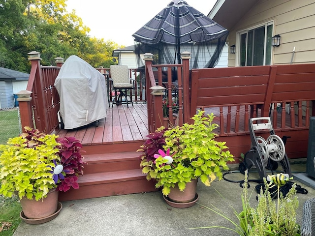 deck featuring a grill