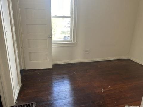 833 Hickory St, Waukegan, IL 60085 - empty room featuring wood finished floors and baseboards