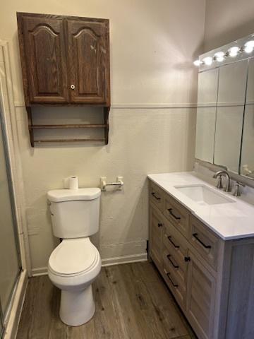 833 Hickory St, Waukegan, IL 60085 - full bathroom with vanity, wood finished floors, and a stall shower