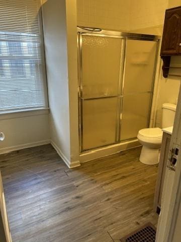 833 Hickory St, Waukegan, IL 60085 - bathroom with wood finished floors, a shower stall, and vanity