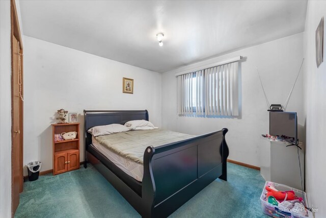 bedroom featuring dark colored carpet