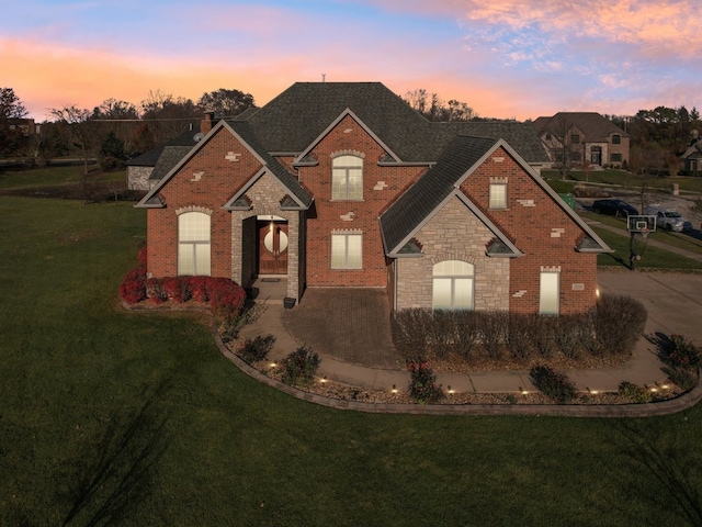 front facade with a yard