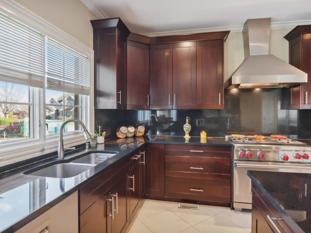 kitchen with sink, wall chimney range hood, crown molding, decorative backsplash, and designer range