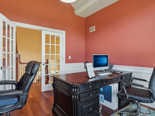 home office with vaulted ceiling, dark wood-type flooring, and french doors