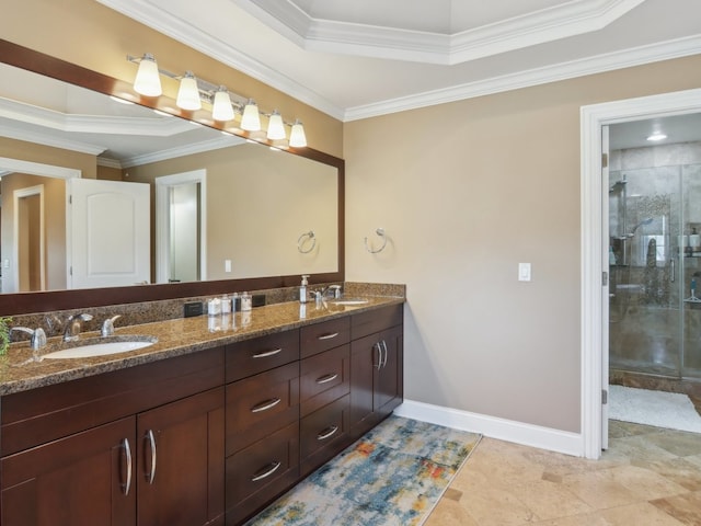 bathroom featuring vanity, crown molding, and walk in shower