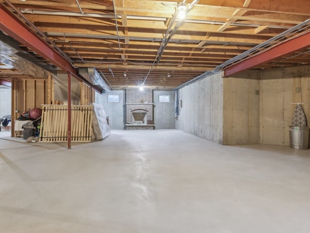 basement with a brick fireplace