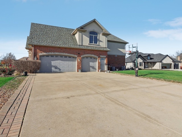 view of front facade featuring a garage and a front lawn