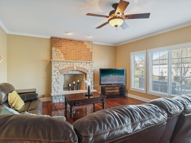 living room with ceiling fan, a fireplace, dark hardwood / wood-style floors, and ornamental molding