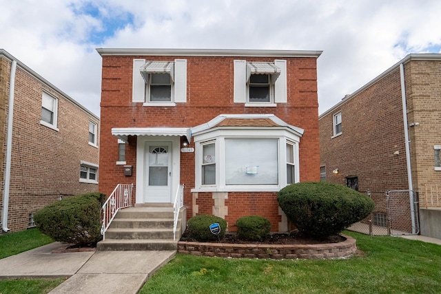 multi unit property featuring a front yard