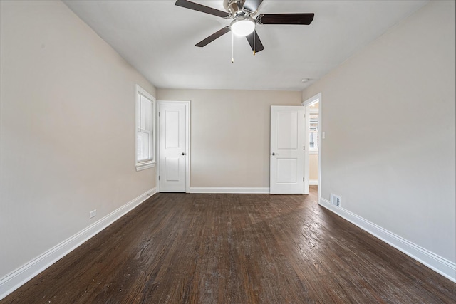 unfurnished room featuring ceiling fan and dark hardwood / wood-style floors