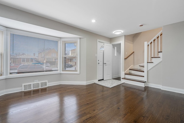 entryway with dark wood-type flooring