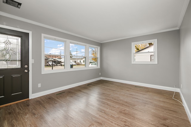 entrance foyer with crown molding and wood-type flooring