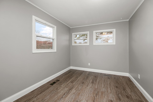 unfurnished room featuring crown molding and dark hardwood / wood-style flooring