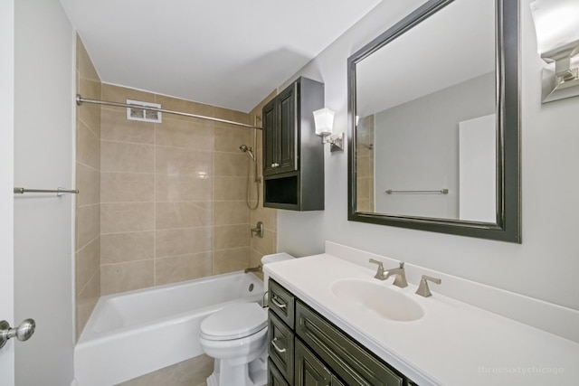 full bathroom featuring vanity, toilet, and tiled shower / bath