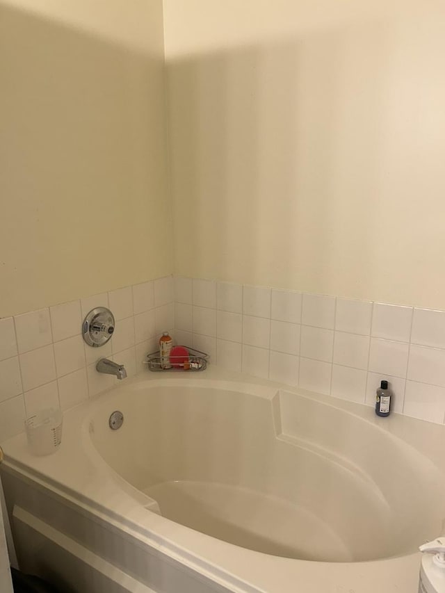 bathroom featuring a tub to relax in