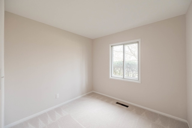 empty room with carpet flooring