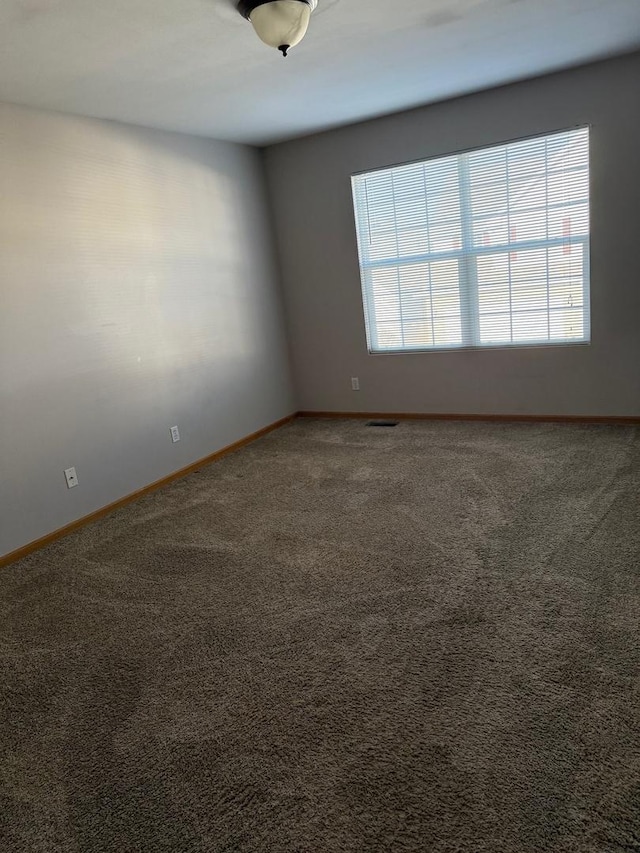 view of carpeted spare room