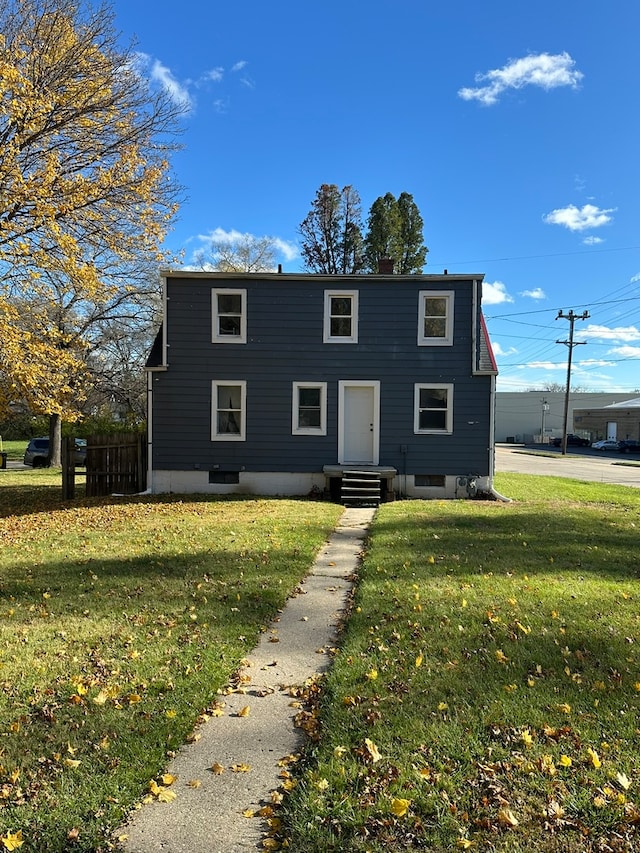 view of front of house with a front lawn