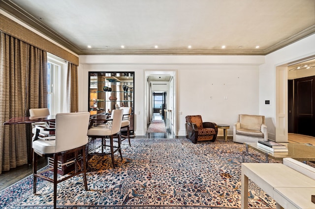 dining room with carpet floors and crown molding