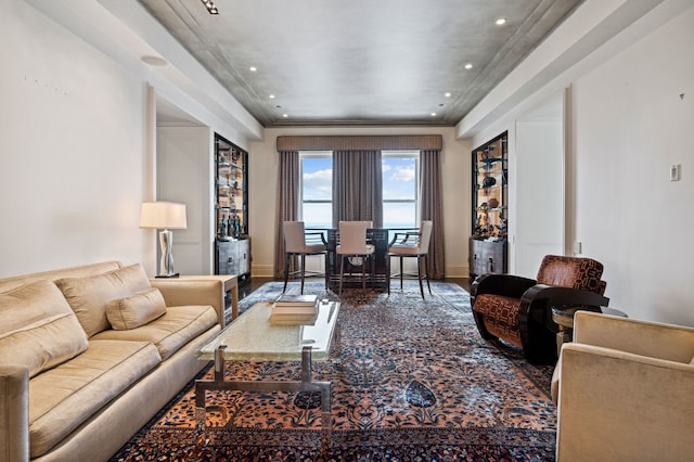 living room with hardwood / wood-style floors and ornamental molding