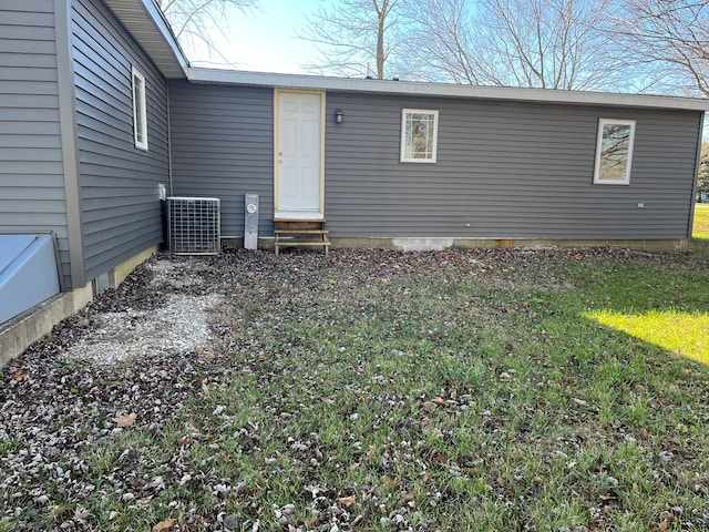 rear view of property featuring cooling unit