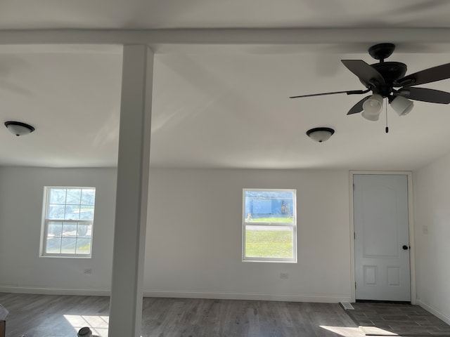 spare room featuring ceiling fan and hardwood / wood-style flooring