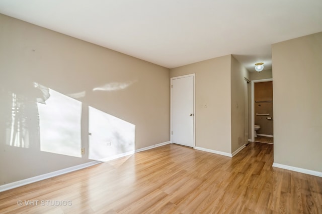 empty room with light hardwood / wood-style floors