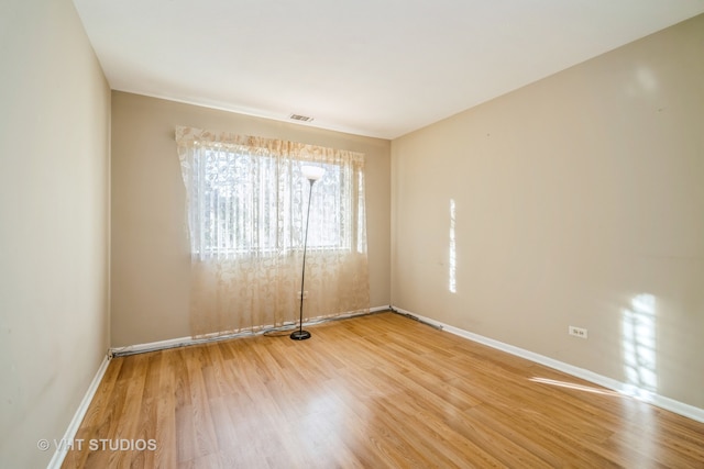 empty room featuring hardwood / wood-style flooring