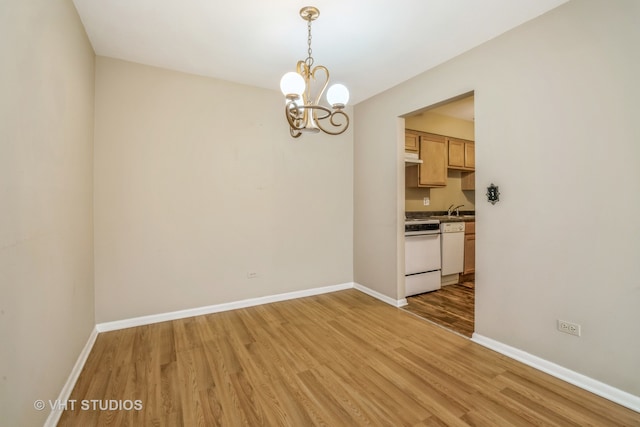 unfurnished dining area featuring hardwood / wood-style floors and a notable chandelier