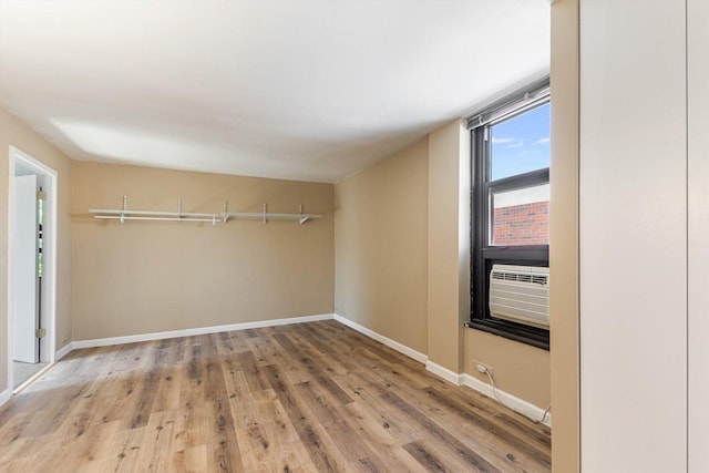 3041 S Michigan Ave Unit 504, Chicago, IL 60616 - empty room with wood finished floors and cooling unit
