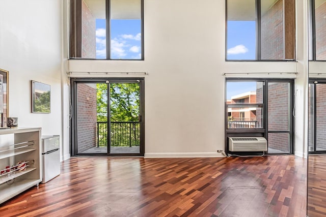 3041 S Michigan Ave Unit 504, Chicago, IL 60616 - unfurnished living room featuring a high ceiling and wood finished floors