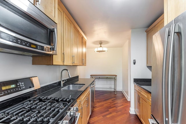 3041 S Michigan Ave Unit 504, Chicago, IL 60616 - kitchen featuring appliances with stainless steel finishes, dark wood-style flooring, and dark stone countertops