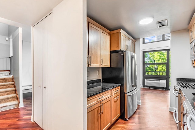 3041 S Michigan Ave Unit 504, Chicago, IL 60616 - kitchen featuring stainless steel appliances, wood finished floors, and dark stone counters