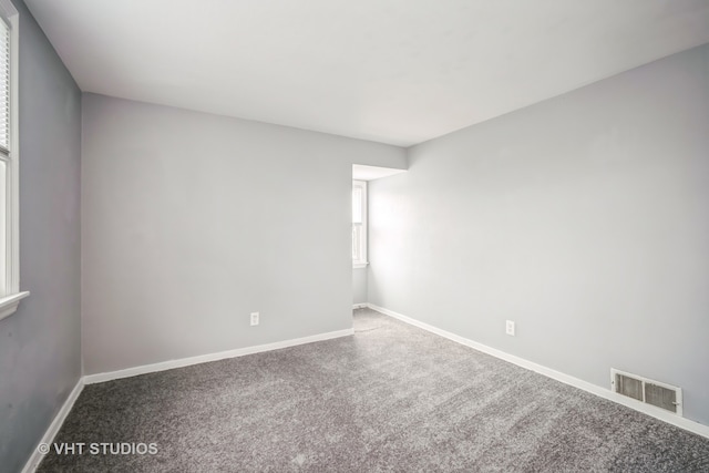 additional living space with carpet floors and vaulted ceiling