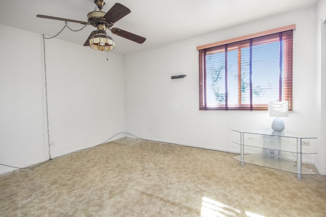 spare room with ceiling fan and carpet floors