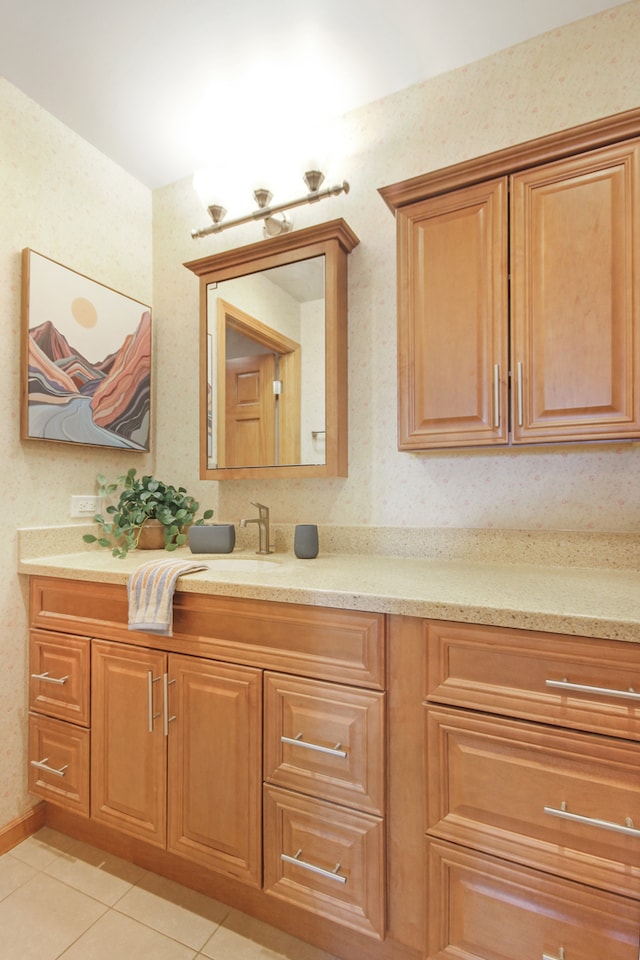 bathroom featuring tile patterned flooring and vanity