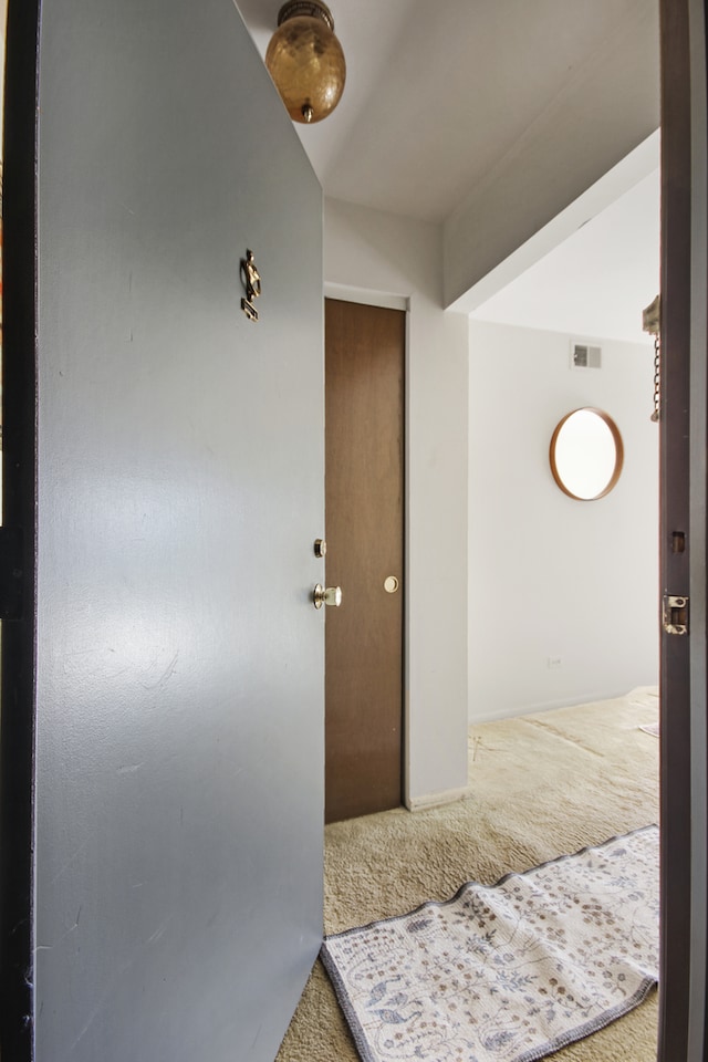 corridor with carpet flooring