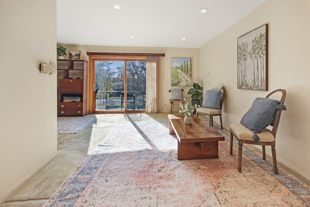 living area with light colored carpet