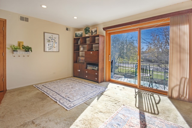 sitting room with carpet flooring