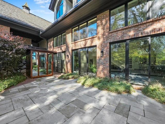 rear view of house with a patio